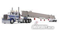 
              DCP by First Gear White/Blue Peterbilt Model 389 Day Cab & ERMC 4-Axle Hydra-Steer Trailer With Bridge Beam Section Load 1/64
            